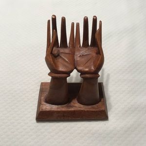 Hand carved wooden hand display made in Indonesia